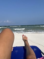 A well-endowed older woman is pleasuring herself