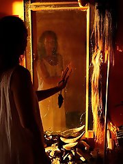 An amazing old lady is posing almost naked in stunning shots